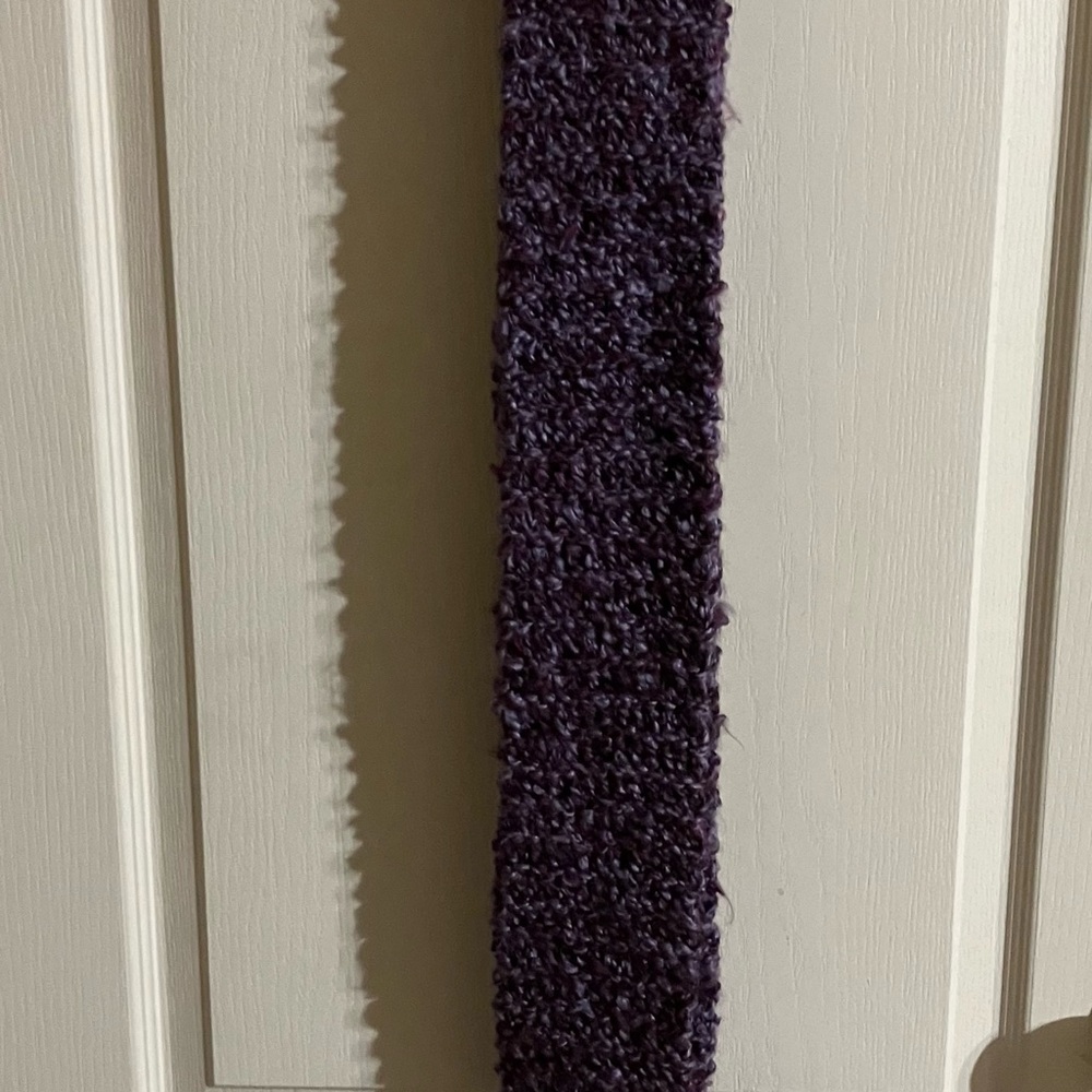 Your ultimate accessory is here. Handcrafted scarf with purple shades.